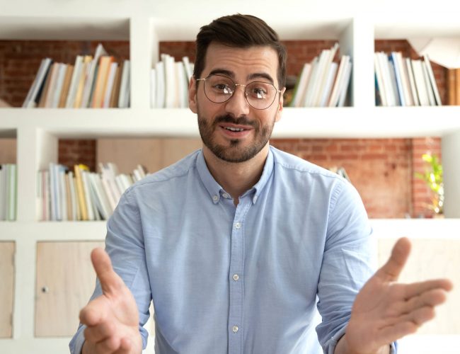 Man in online interview coaching session developing interview skills.